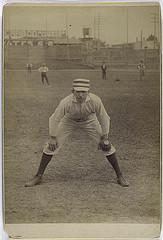 old school baseball infielder and baseball glove