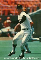 Shortstop Spier charging groundball and throwing to first base