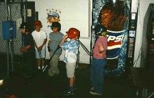 8u baseball players getting ready to bat at the batting cages