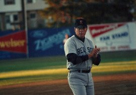 thirdbase coach Dave Holt using simple baseball signs system with claps