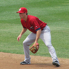 infielder Phelps in ready position for fast catch throwing drills