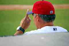 Sandberg giving baseball signs from the dugout.