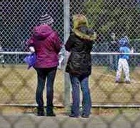 baseball moms enjoying games on cool night