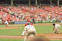 Baserunner diving back to 1b on pick off play