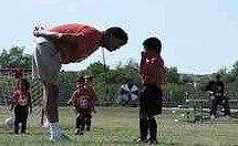 dad coach yelling at ballplayer