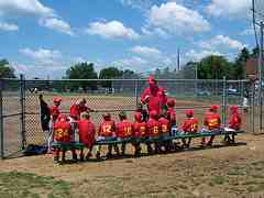 Baseball Players in the dugout ready to play